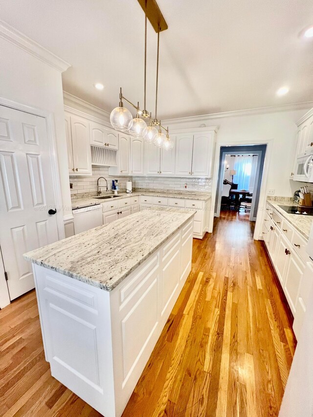 305 Chris Ln, Winfield, AL 35594 - kitchen with white appliances, crown molding, decorative backsplash, and white cabinets