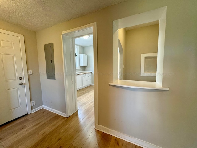 1532 SW Bay Ave, Birmingham, AL 35211 - corridor featuring electric panel, wood finished floors, and a textured ceiling