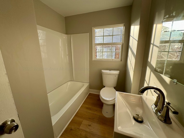 1532 SW Bay Ave, Birmingham, AL 35211 - full bathroom with wood finished floors and shower / tub combination