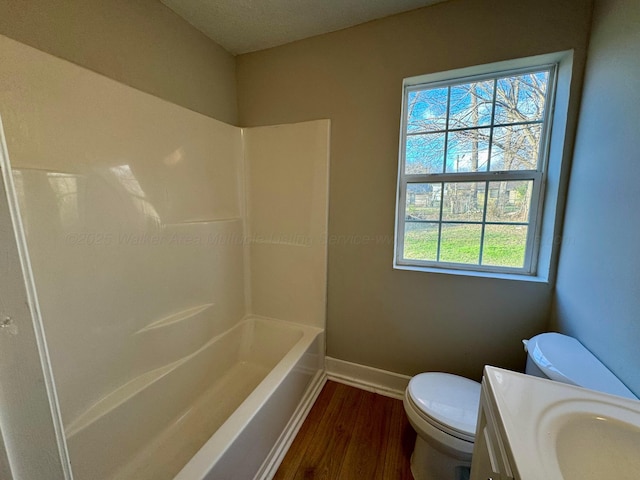 1532 SW Bay Ave, Birmingham, AL 35211 - full bath featuring wood finished floors, vanity, and shower / tub combination