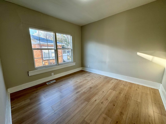 1532 SW Bay Ave, Birmingham, AL 35211 - spare room featuring wood finished floors