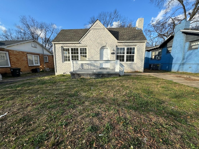 1532 SW Bay Ave, Birmingham, AL 35211 - view of front of house with a chimney, roof with shingles, a front lawn, and a deck