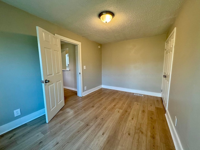 1532 SW Bay Ave, Birmingham, AL 35211 - empty room featuring wood finished floors and a textured ceiling