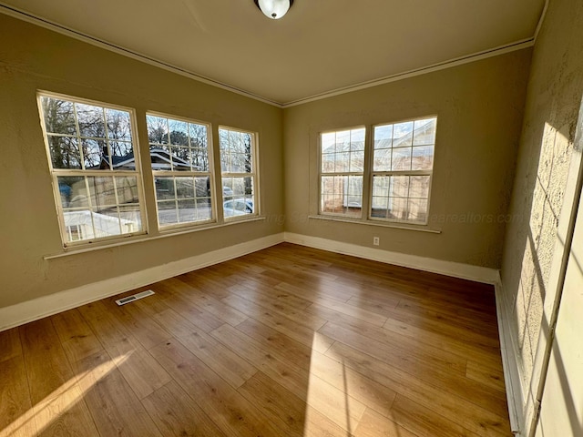 1532 SW Bay Ave, Birmingham, AL 35211 - spare room featuring crown molding and hardwood / wood-style flooring