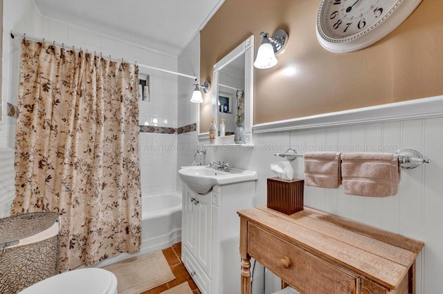 2555 Shady Rd, Adamsville, AL 35005 - bathroom with shower / bath combo with shower curtain, vanity, tile patterned floors, and a wainscoted wall