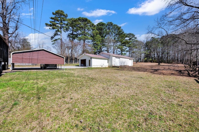 2555 Shady Rd, Adamsville, AL 35005 - view of green lawn with an outdoor structure and a detached garage