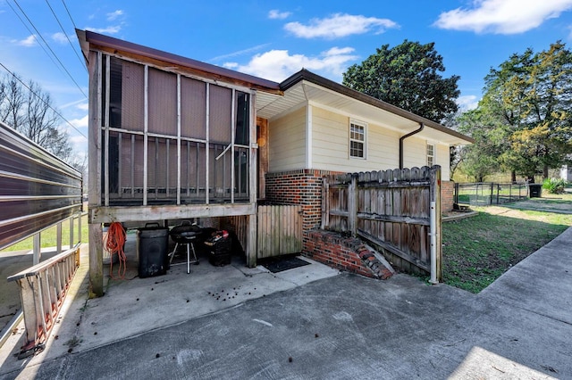 2555 Shady Rd, Adamsville, AL 35005 - view of side of home with brick siding and a sunroom