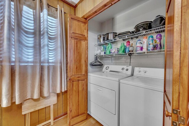 2555 Shady Rd, Adamsville, AL 35005 - laundry room featuring separate washer and dryer and light wood-type flooring