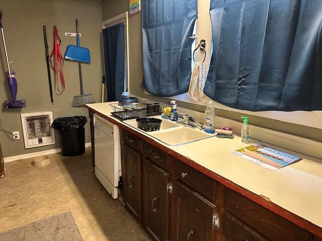 1619 14th Ave, Haleyville, AL 35565 - kitchen featuring dishwasher, light countertops, heating unit, and dark brown cabinets