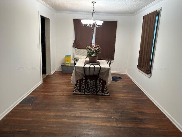 1619 14th Ave, Haleyville, AL 35565 - dining space with a chandelier, ornamental molding, wood finished floors, and a textured ceiling