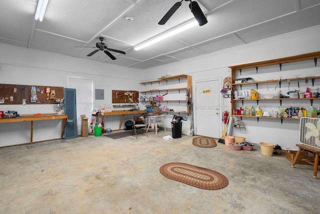 5746 Old Birmingham Hwy, Jasper, AL 35501 - garage featuring a workshop area, ceiling fan, and electric panel