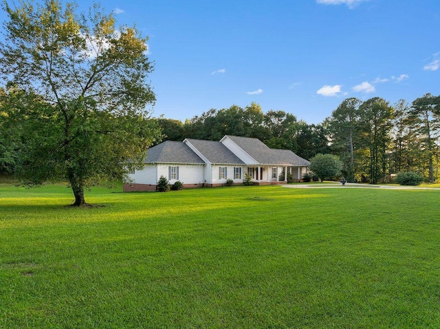 5746 Old Birmingham Hwy, Jasper, AL 35501 - ranch-style home with a front lawn, crawl space, and view of wooded area