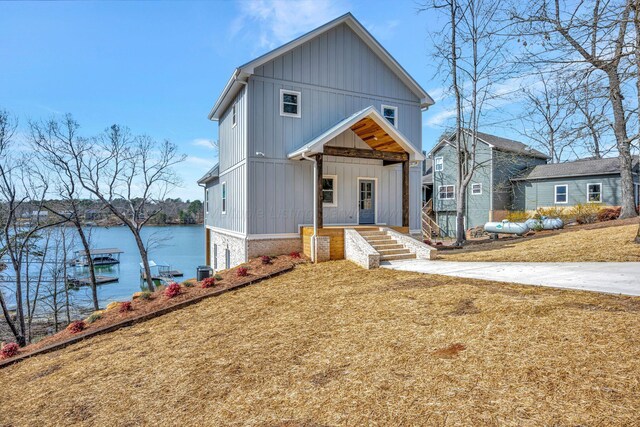 556 Sipsey Rock Rd, Crane Hill, AL 35053 - view of front of house with central AC unit, a front yard, and a water view