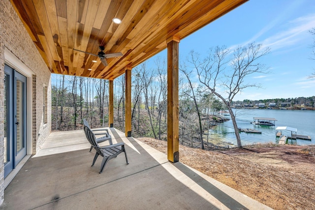 556 Sipsey Rock Rd, Crane Hill, AL 35053 - view of patio with a ceiling fan, a dock, and a water view