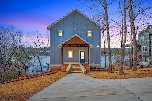 556 Sipsey Rock Rd, Crane Hill, AL 35053 - view of front facade featuring covered porch and board and batten siding