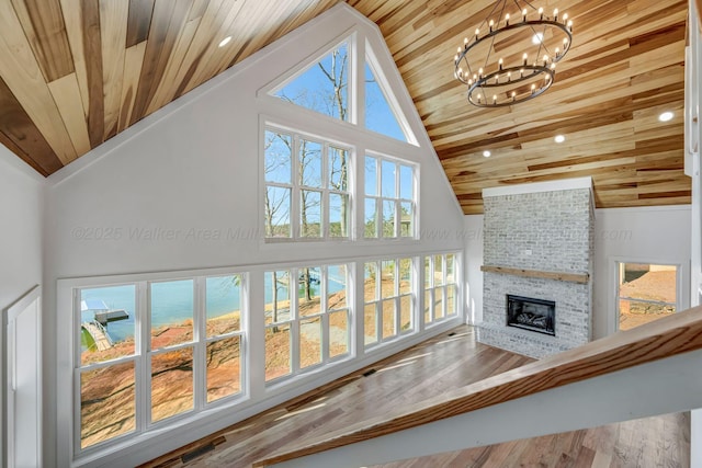 556 Sipsey Rock Rd, Crane Hill, AL 35053 - living room featuring wood ceiling, a notable chandelier, and a brick fireplace