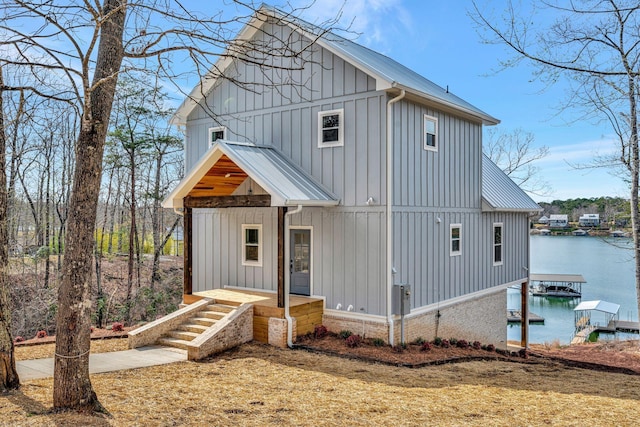556 Sipsey Rock Rd, Crane Hill, AL 35053 - view of front of property with board and batten siding, a water view, and a boat dock