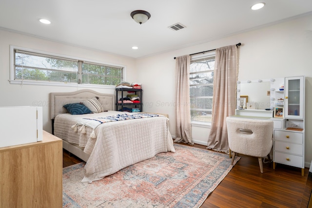 bedroom with dark hardwood / wood-style flooring