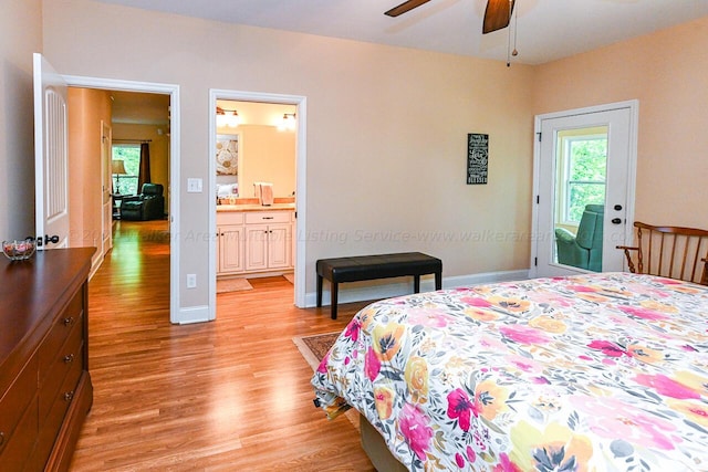 1528 Sipsey Rd, Double Springs, AL 35553 - bedroom with baseboards, ensuite bath, and light wood finished floors