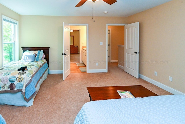 1528 Sipsey Rd, Double Springs, AL 35553 - bedroom with light carpet, ensuite bath, baseboards, and ceiling fan