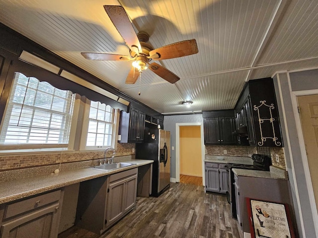 2701 N Airport Rd, Jasper, AL 35504 - kitchen with a sink, a ceiling fan, black appliances, decorative backsplash, and dark wood-type flooring