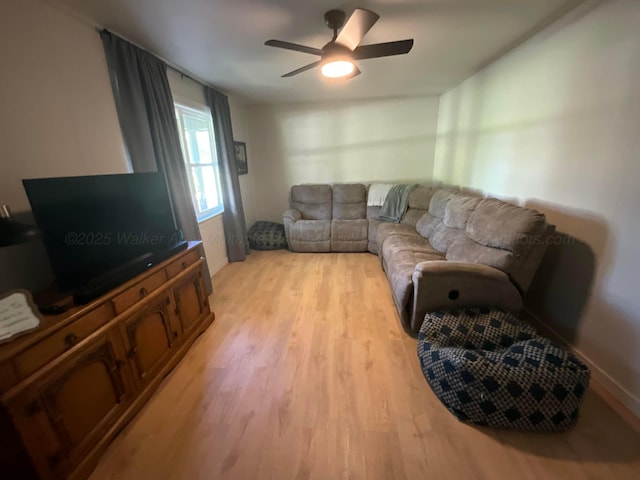 1728 Primrose Dr, Cullman, AL 35055 - living area with light wood finished floors, baseboards, and ceiling fan