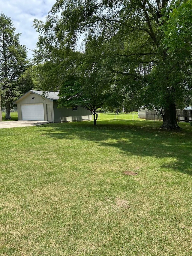 1728 Primrose Dr, Cullman, AL 35055 - view of yard with a garage, an outdoor structure, and concrete driveway