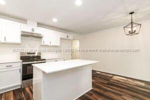 6370 Ball Rd, Mount Olive, AL 35117 - kitchen with stainless steel range with electric cooktop, under cabinet range hood, recessed lighting, dark wood-style flooring, and a center island
