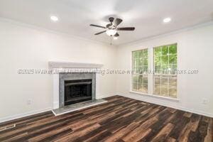 6370 Ball Rd, Mount Olive, AL 35117 - unfurnished living room with crown molding, a fireplace with raised hearth, wood finished floors, recessed lighting, and a ceiling fan