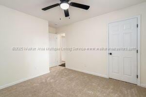 6370 Ball Rd, Mount Olive, AL 35117 - carpeted spare room with ceiling fan and baseboards