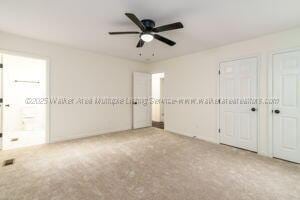 6370 Ball Rd, Mount Olive, AL 35117 - unfurnished bedroom with carpet, two closets, and ceiling fan