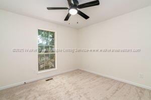 6370 Ball Rd, Mount Olive, AL 35117 - empty room featuring baseboards, carpet floors, and a ceiling fan