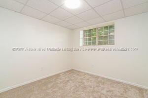 6370 Ball Rd, Mount Olive, AL 35117 - unfurnished room with a drop ceiling, baseboards, and carpet