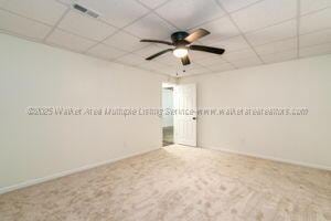 6370 Ball Rd, Mount Olive, AL 35117 - carpeted empty room featuring a ceiling fan, a drop ceiling, and baseboards