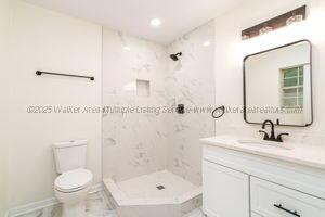 6370 Ball Rd, Mount Olive, AL 35117 - full bath with toilet, vanity, walk in shower, marble finish flooring, and recessed lighting