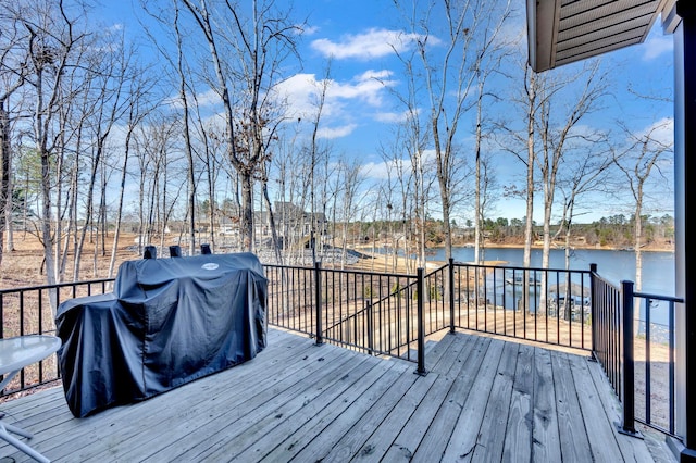 deck featuring a water view and grilling area
