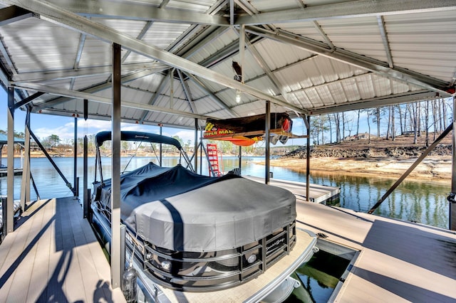 view of dock featuring boat lift and a water view