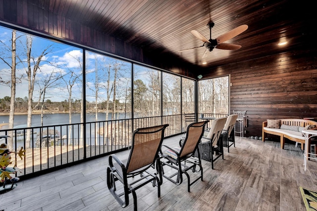 sunroom / solarium with a water view, an outdoor hangout area, and ceiling fan