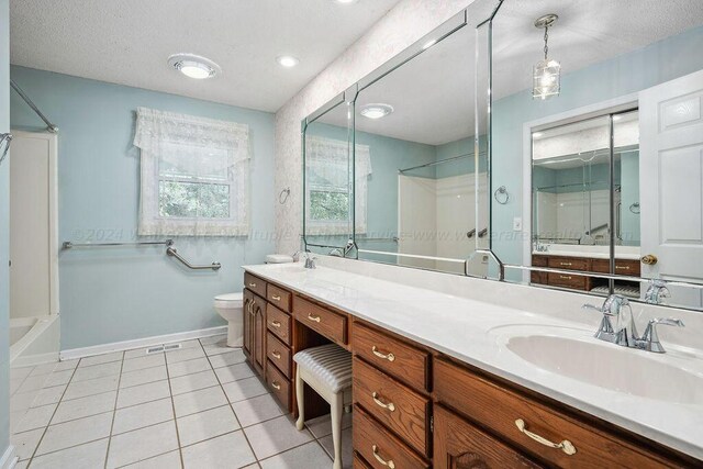 515 River Dr, Quinton, AL 35130 - bathroom with tile patterned floors, a shower, double vanity, and a sink