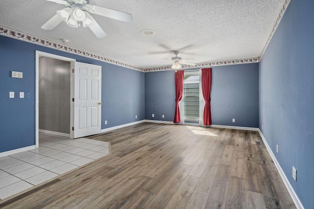 515 River Dr, Quinton, AL 35130 - spare room featuring wood finished floors, a textured ceiling, baseboards, and ceiling fan