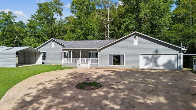 515 River Dr, Quinton, AL 35130 - single story home with covered porch, a detached carport, a front lawn, and concrete driveway