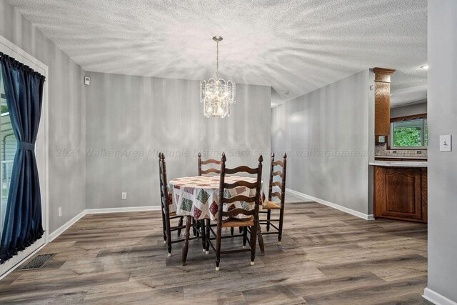 515 River Dr, Quinton, AL 35130 - dining area featuring wood finished floors, baseboards, a chandelier, and visible vents