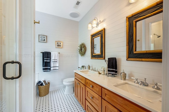 662 Sipsey Pike, Double Springs, AL 35553 - full bath featuring a stall shower, toilet, double vanity, and tile patterned floors