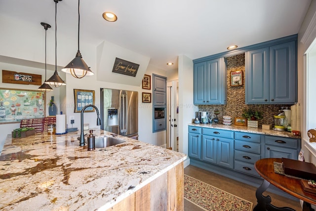 662 Sipsey Pike, Double Springs, AL 35553 - kitchen featuring stainless steel refrigerator with ice dispenser, blue cabinets, a sink, tasteful backsplash, and pendant lighting