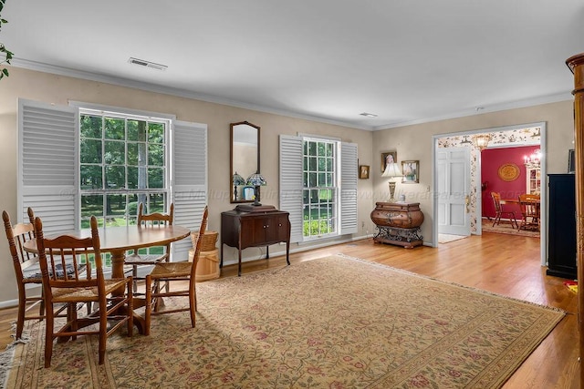 505 3rd Ave, Jasper, AL 35501 - dining area with wood finished floors, a chandelier, and ornamental molding