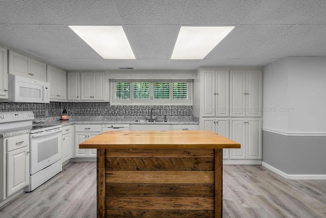 505 3rd Ave, Jasper, AL 35501 - kitchen with white appliances, light wood-type flooring, butcher block countertops, a drop ceiling, and white cabinetry