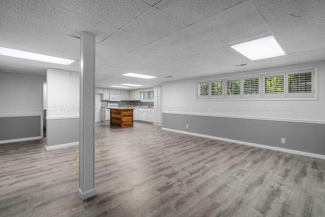 505 3rd Ave, Jasper, AL 35501 - below grade area featuring wood finished floors and a paneled ceiling