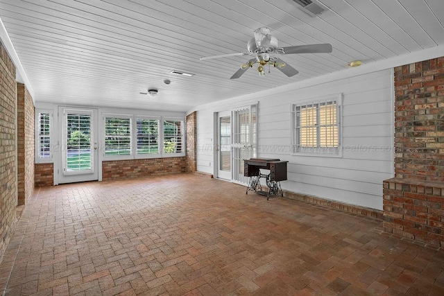 505 3rd Ave, Jasper, AL 35501 - unfurnished sunroom featuring brick wall, brick floors, and wood ceiling