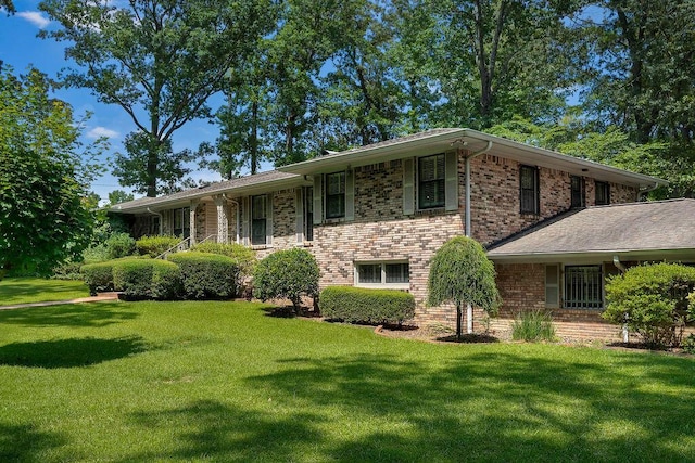 505 3rd Ave, Jasper, AL 35501 - view of front of property with a front yard and brick siding