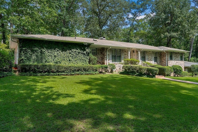 505 3rd Ave, Jasper, AL 35501 - view of front of home with a front yard and brick siding